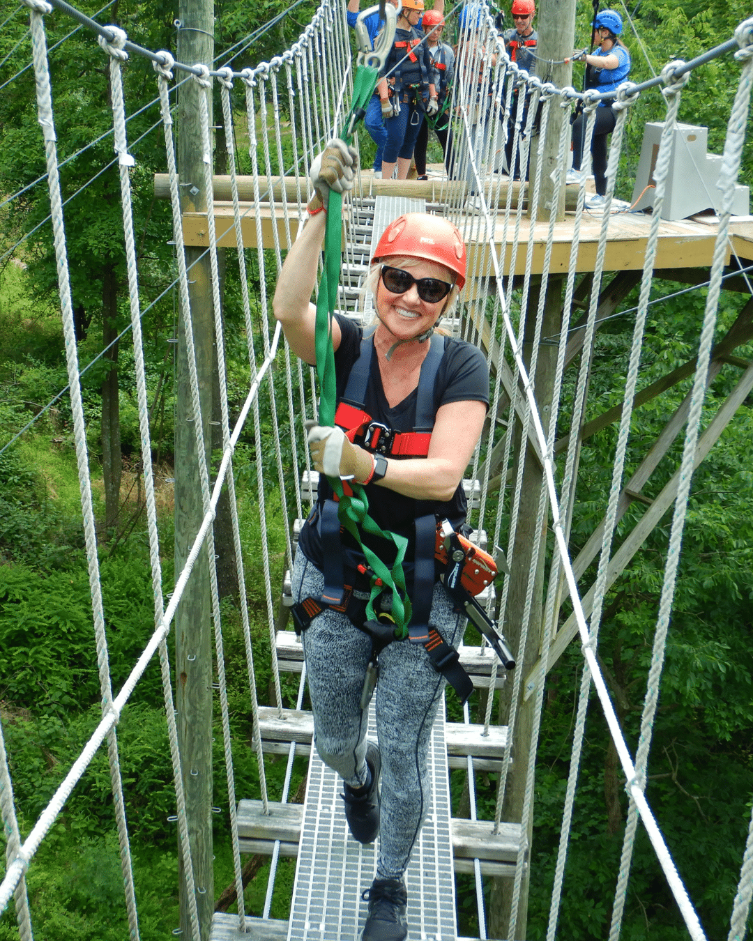 Zipline rider at sunset